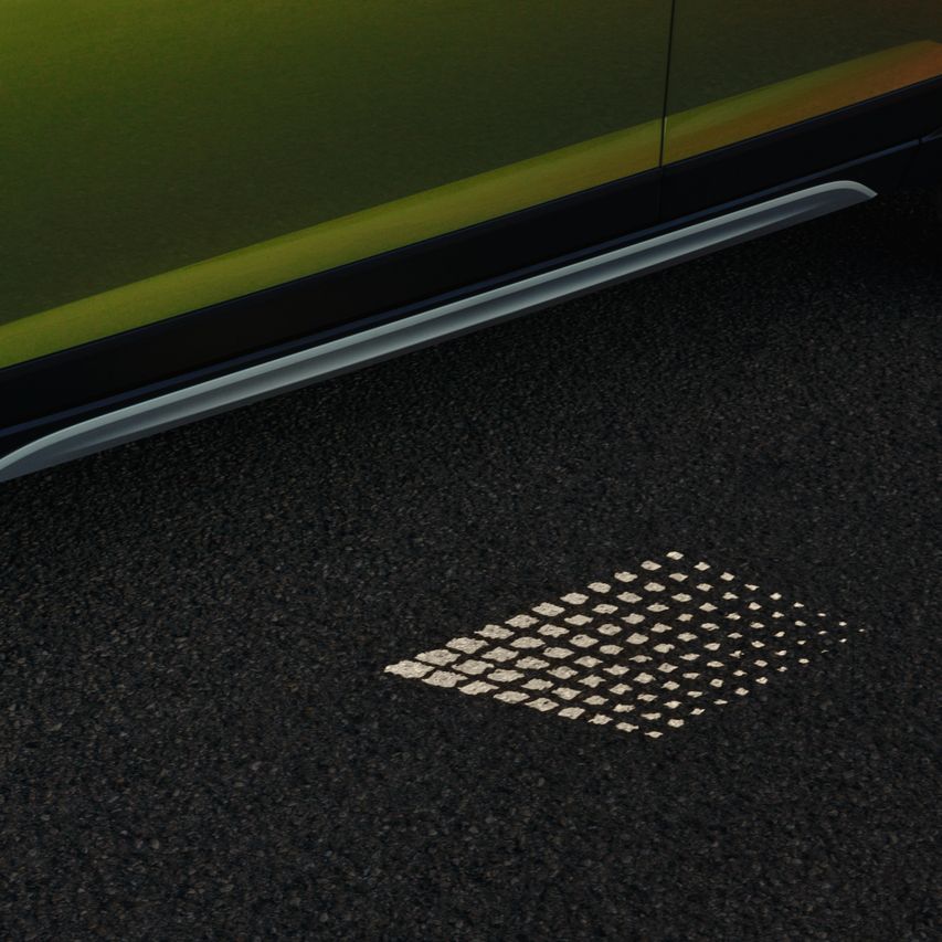 Svetlobna projekcija pod vrati modela VW Taigo