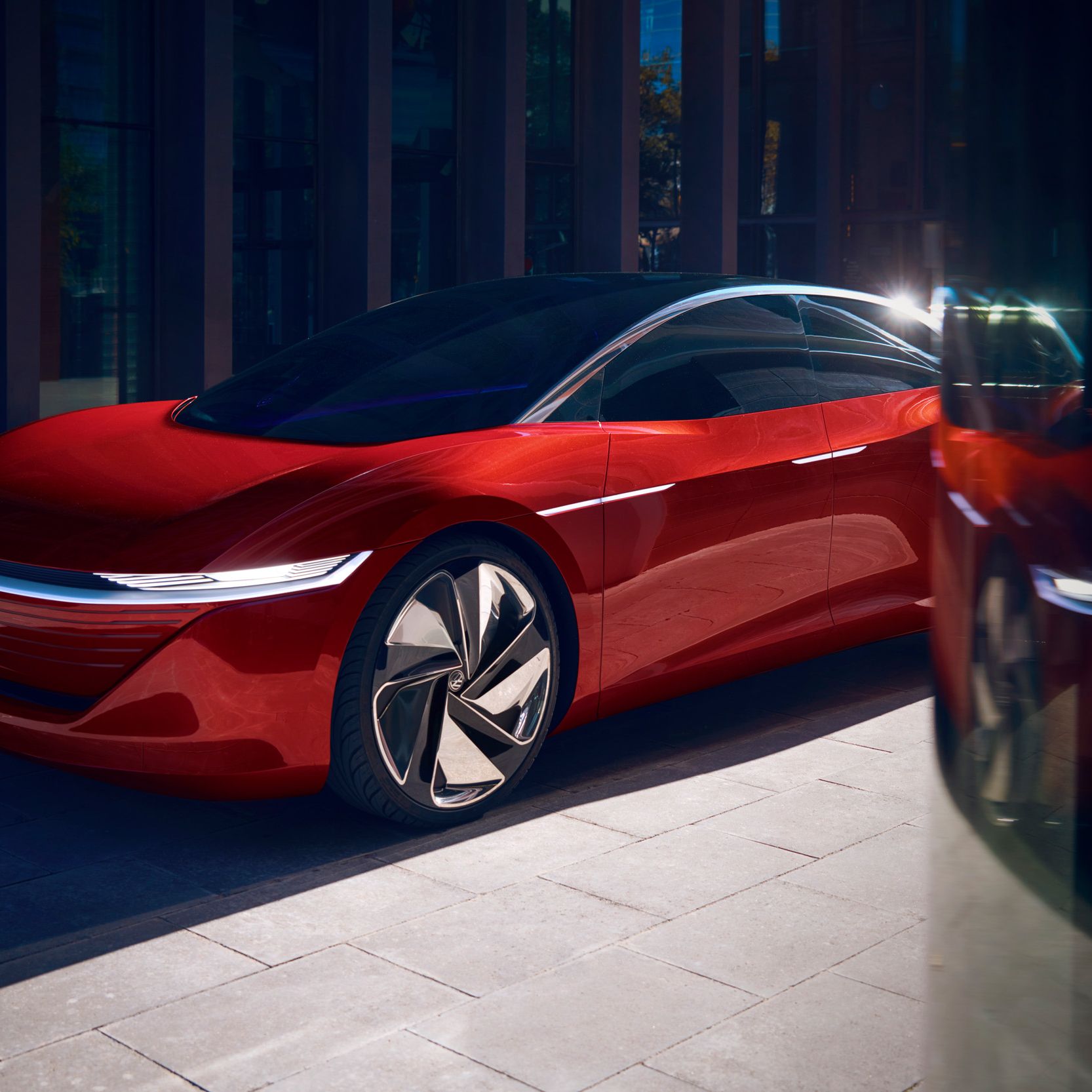 VW ID. Vizzion električni avto rdeča sprednji del pogled od strani