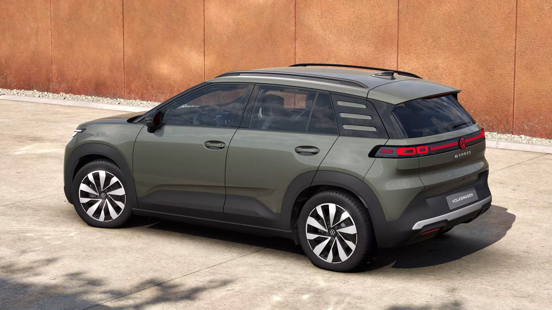 Na sliki je zelen VW ID. Cross Style, prikazan diagonalno od zadaj.